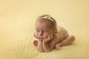 Side froggy pose newborn photography Perth